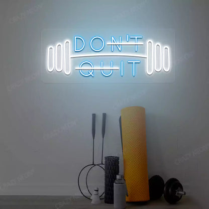 ice blue and white don’t quit do it neon sign mounted on a wall