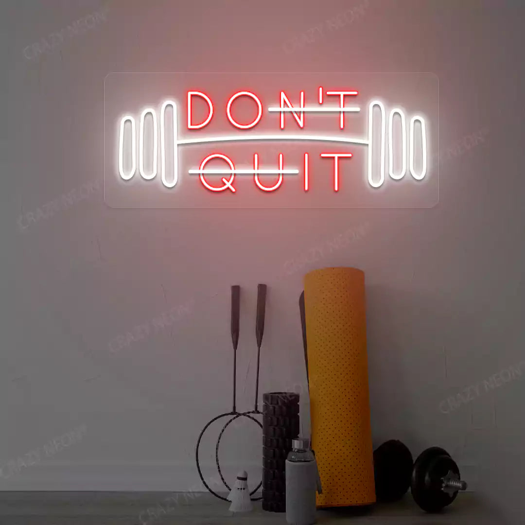 red and white don’t quit do it neon sign mounted on a wall
