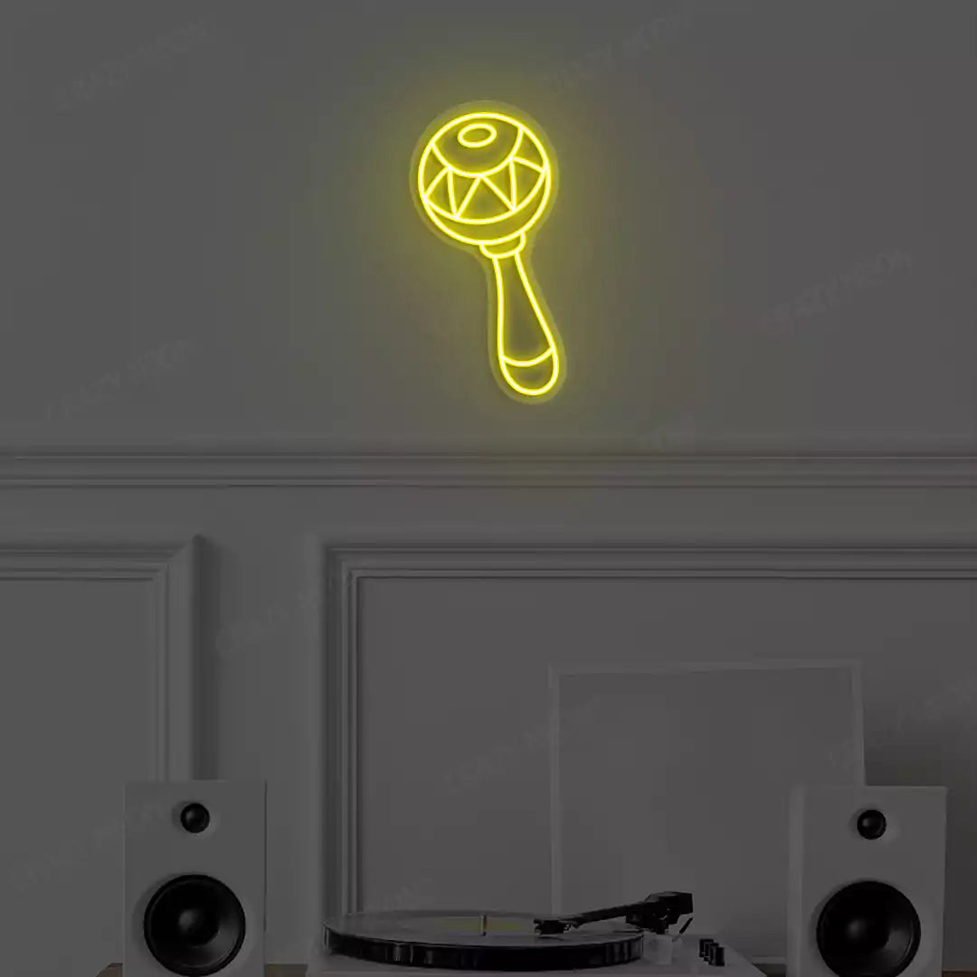yellow maraca neon sign mounted on a wall