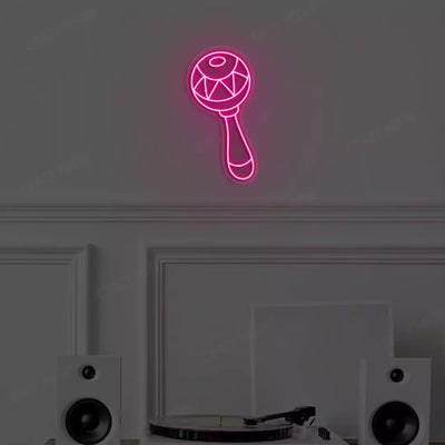 pink maraca neon sign mounted on a wall