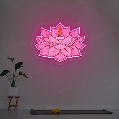 Lotus Candle Neon Artwork lighting up in pink color in a yoga room