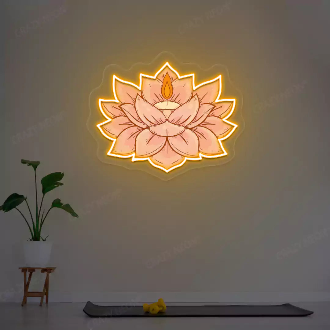 Lotus Candle Neon Artwork lighting up in orange color in a yoga room