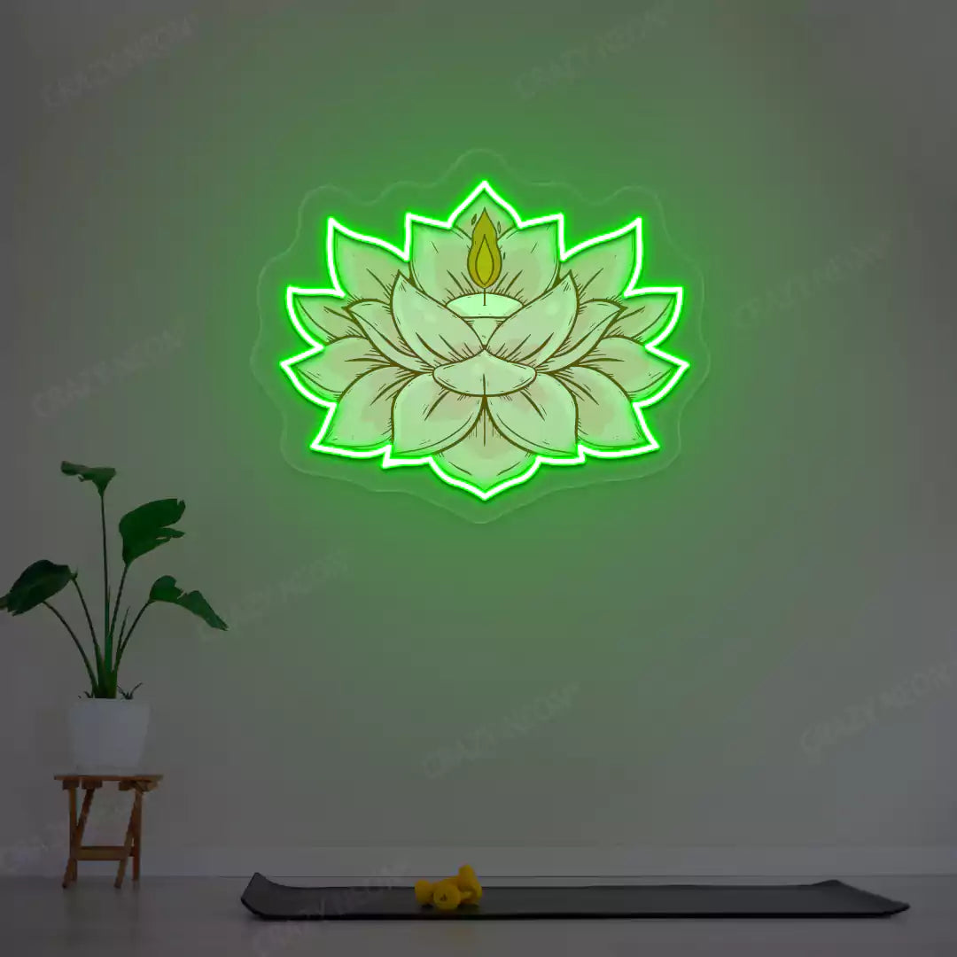 Lotus Candle Neon Artwork lighting up in green color in a yoga room