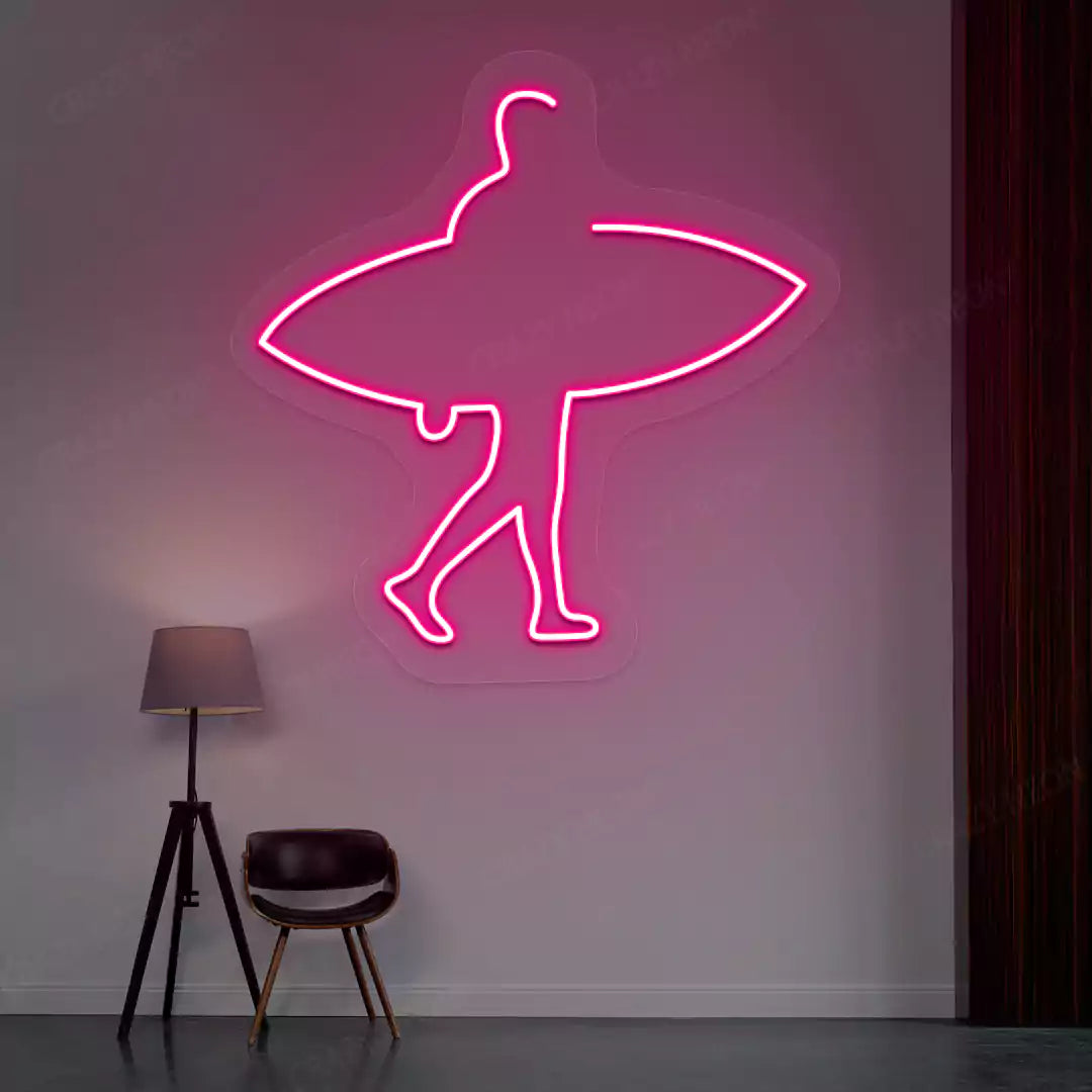 pink man surfer neon sign mounted on a wall
