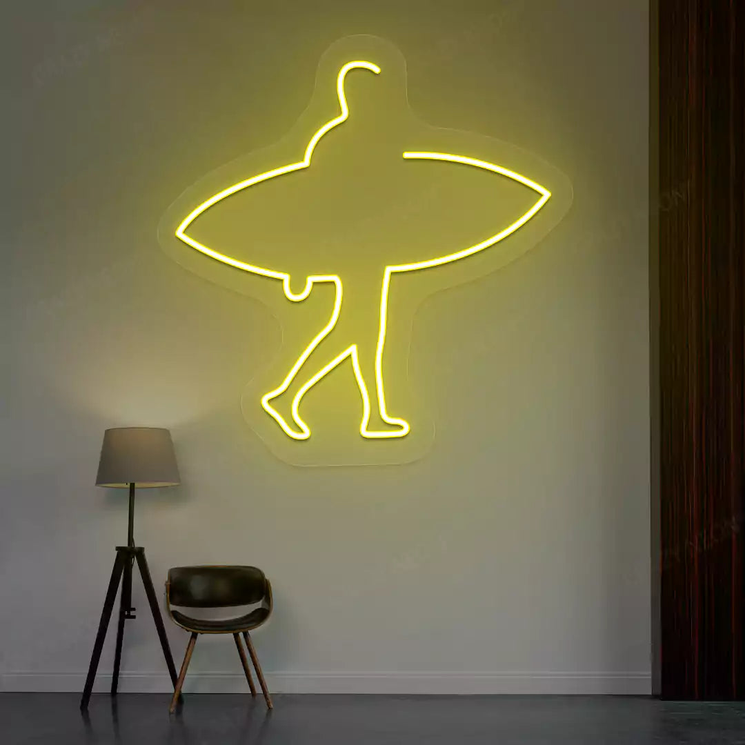 yellow man surfer neon sign mounted on a wall