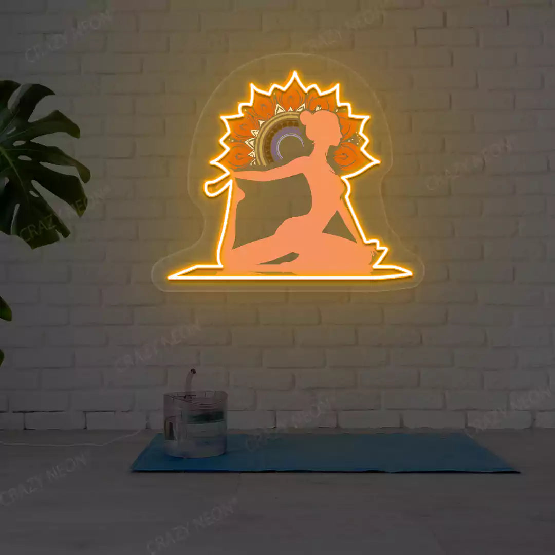 One-Legged King Pigeon Pose Mandala Yoga Neon Artwork lighting up in orange color in a yoga room