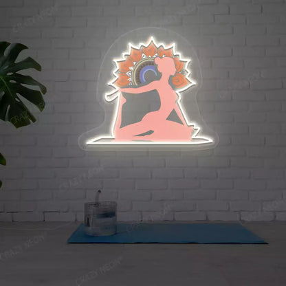 One-Legged King Pigeon Pose Mandala Yoga Neon Artwork lighting up in warm white color in a yoga room