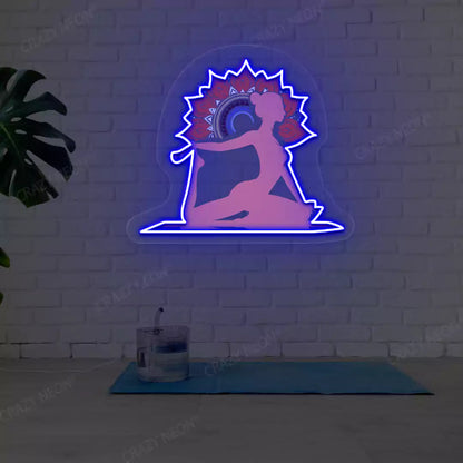 One-Legged King Pigeon Pose Mandala Yoga Neon Artwork lighting up in blue color in a yoga room