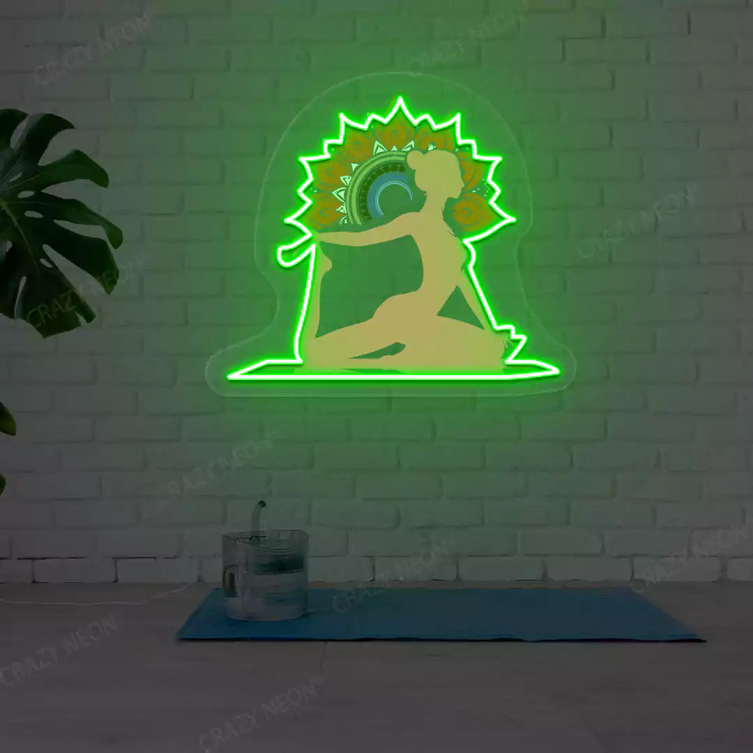 One-Legged King Pigeon Pose Mandala Yoga Neon Artwork lighting up in green color in a yoga room