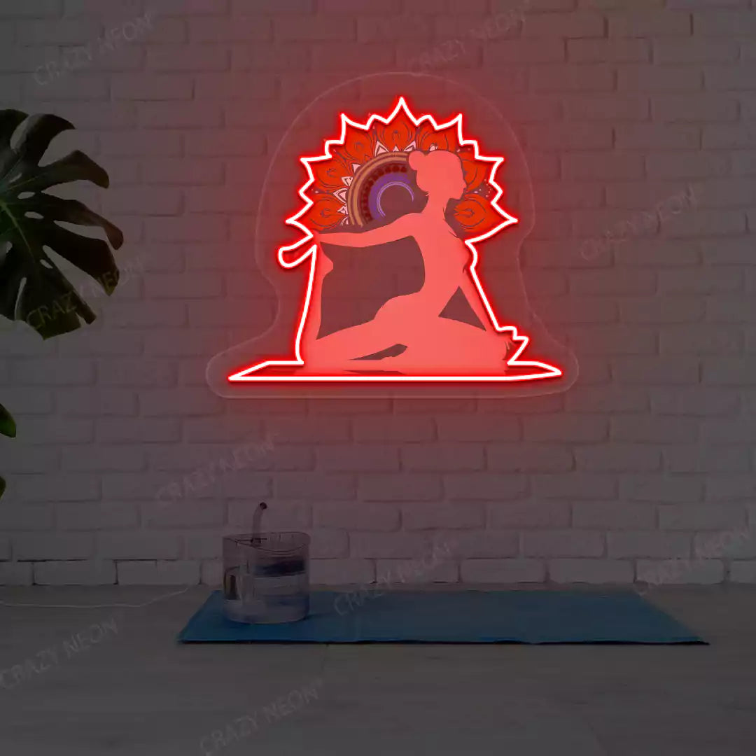 One-Legged King Pigeon Pose Mandala Yoga Neon Artwork lighting up in red color in a yoga room