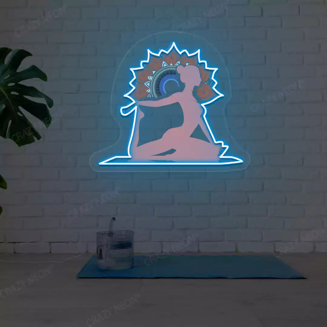 One-Legged King Pigeon Pose Mandala Yoga Neon Artwork lighting up in iceblue color in a yoga room