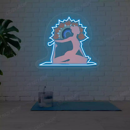 One-Legged King Pigeon Pose Mandala Yoga Neon Artwork lighting up in iceblue color in a yoga room