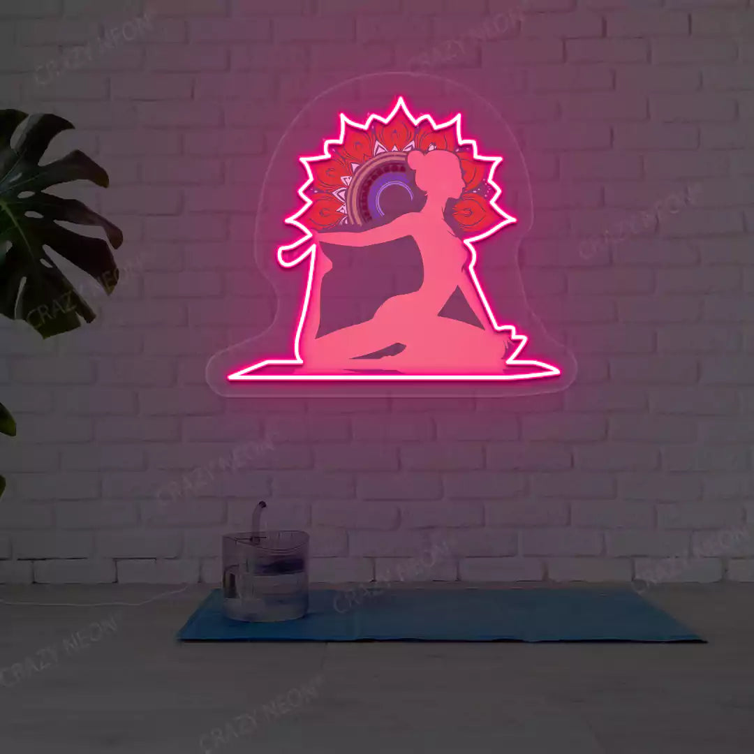 One-Legged King Pigeon Pose Mandala Yoga Neon Artwork lighting up in pink color in a yoga room