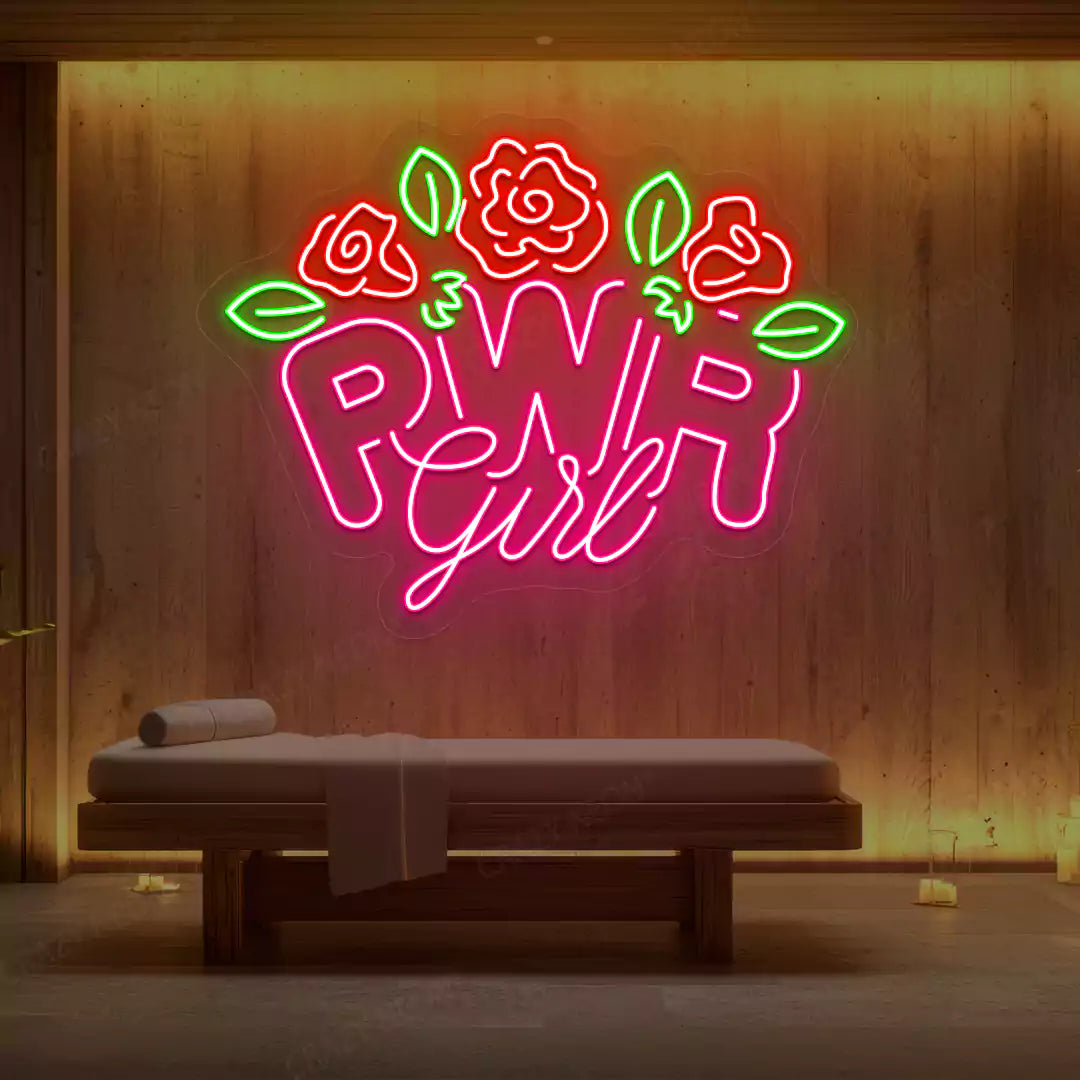 Pink PWR Girl Floral neon sign glowing on a wooden wall