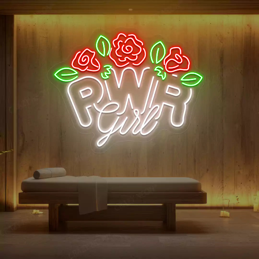 White PWR Girl Floral neon sign glowing on a wooden wall