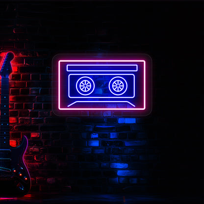 blue and pink cassette tape neon sign mounted on a wall