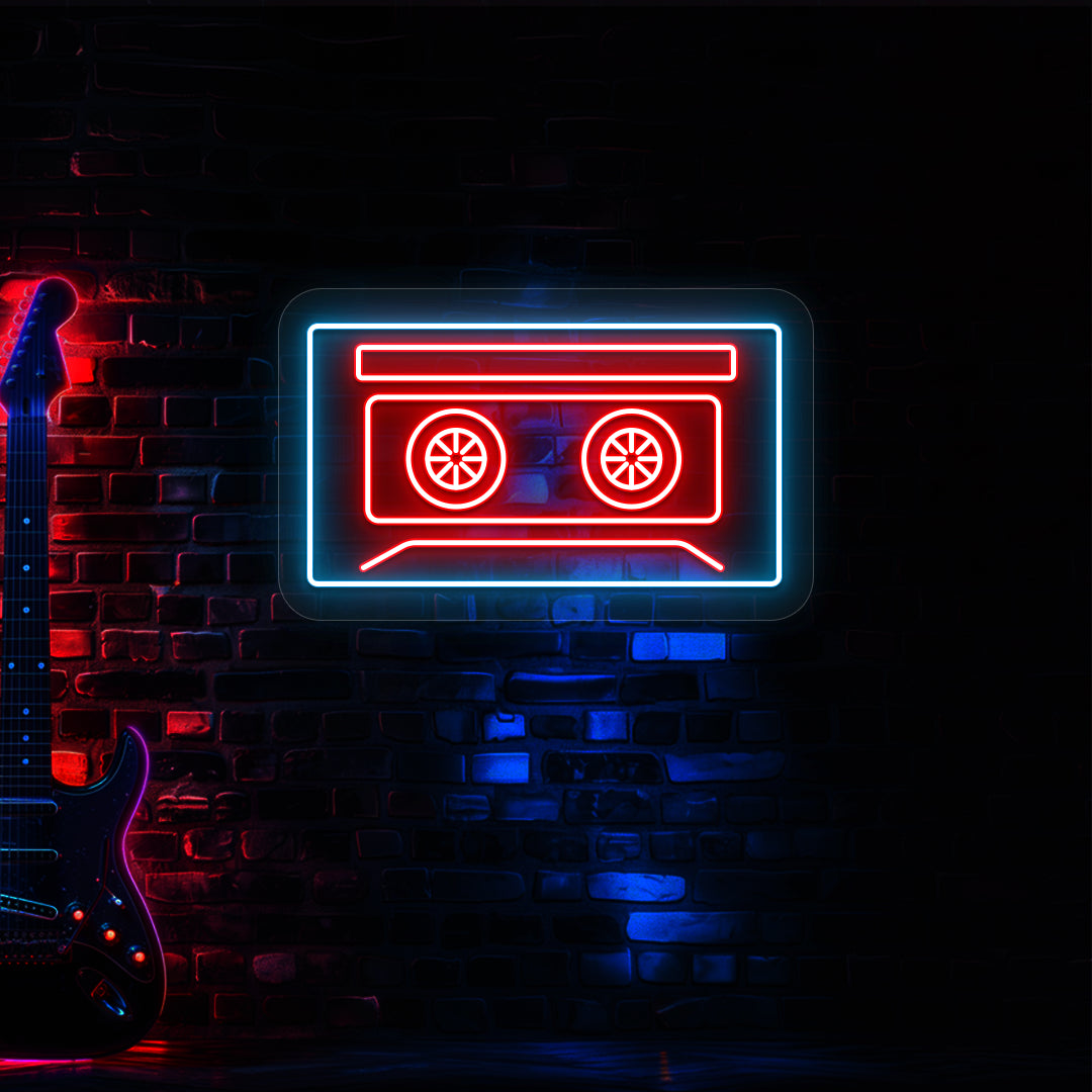 red and ice blue cassette tape neon sign mounted on a wall