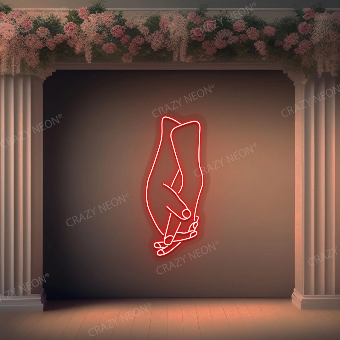 Hands Holding Neon Sign