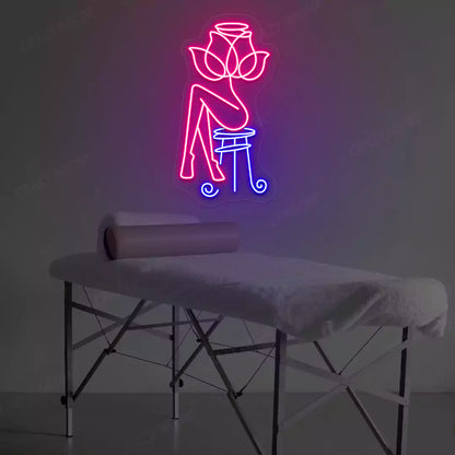 Rose Bliss Spa neon sign in pink and blue colors glowing in a spa room