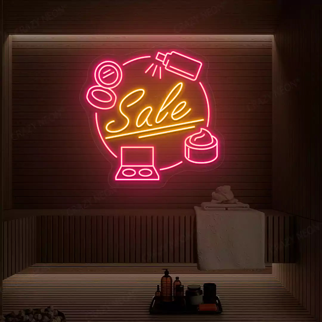 Pink and orange Cosmetic Sale neon sign glowing on a wooden wall