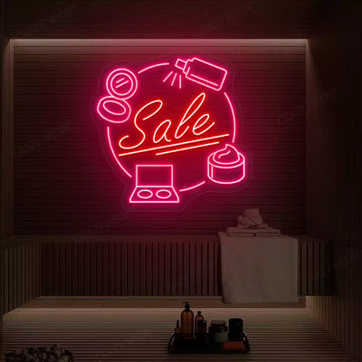 Pink and red Cosmetic Sale neon sign glowing on a wooden wall