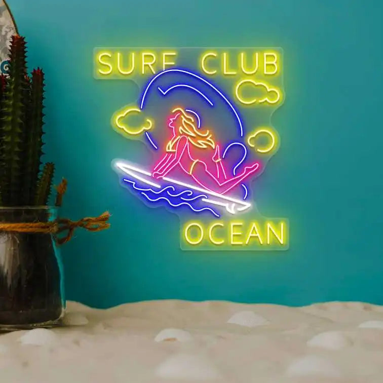 multi color stunt girl surf club ocean neon sign mounted on a wall