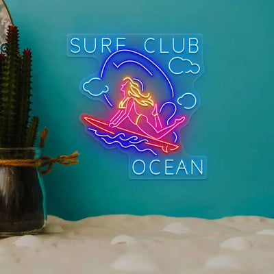multi color stunt girl surf club ocean neon sign mounted on a wall