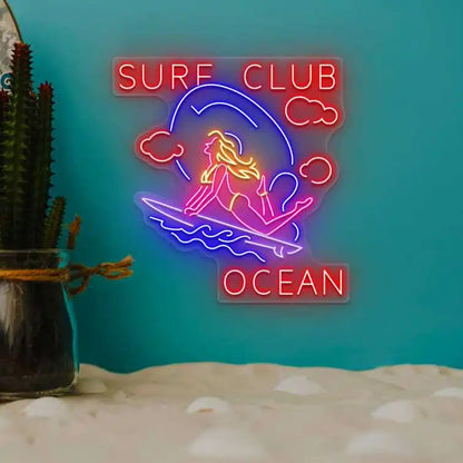 multi color stunt girl surf club ocean neon sign mounted on a wall