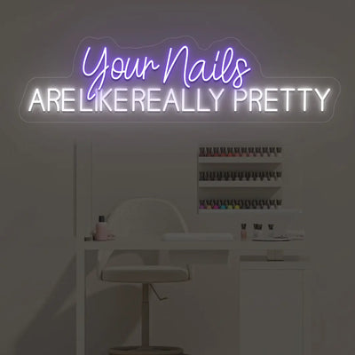 Neon sign featuring playful purple cursive for 'Your Nails' and bright white block letters for 'ARE LIKE REALLY PRETTY' against a light wall