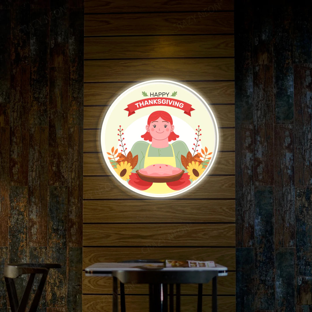 Thanksgiving pie with red-haired chef neon sign in warm white