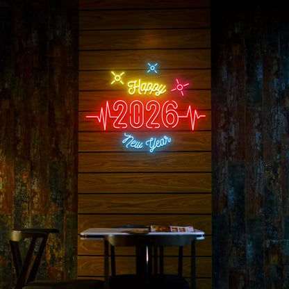 Happy 2026 New Year neon sign in red yellow and blue lights mounted on a wooden wall