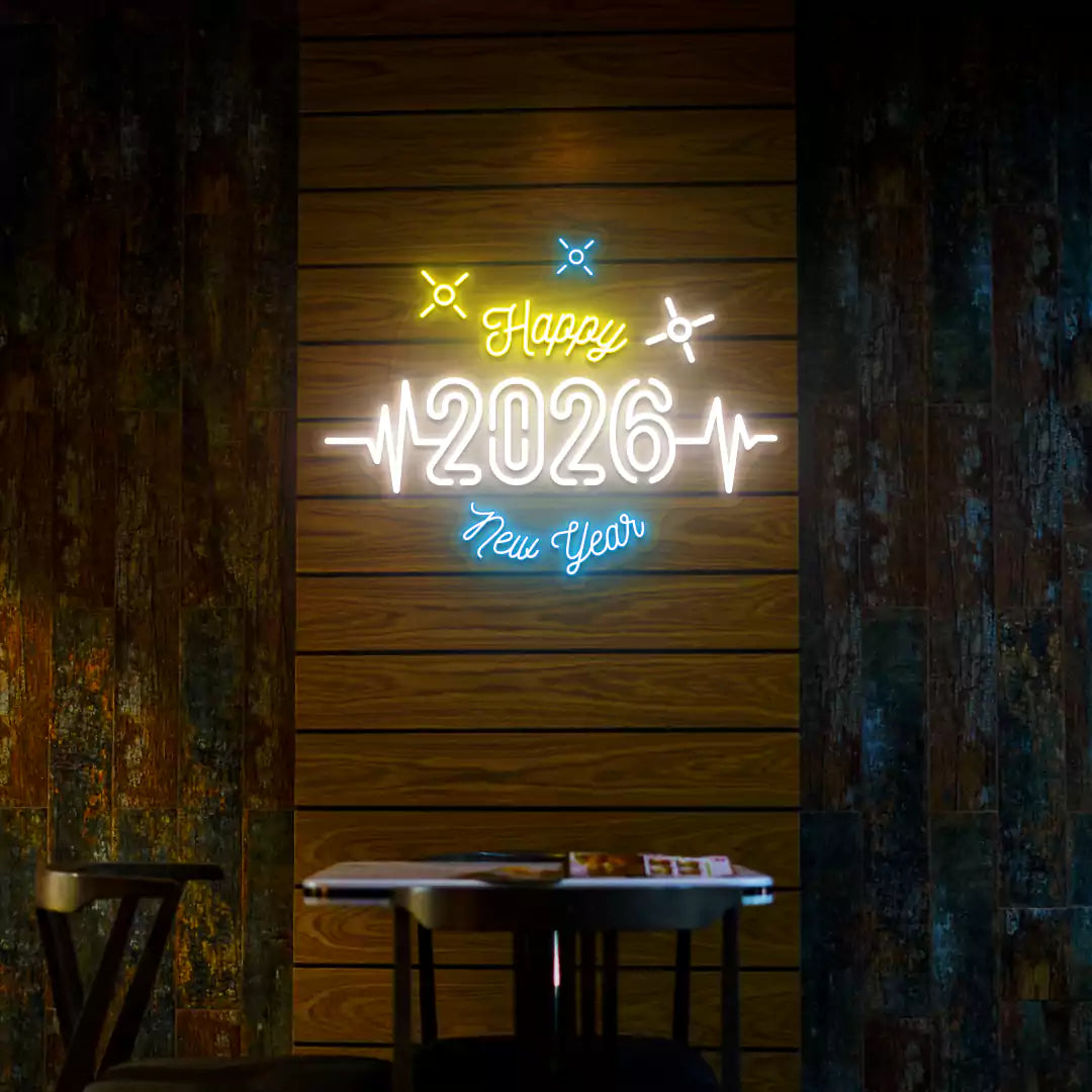 Happy 2026 New Year neon sign in white yellow and blue lights mounted on a wooden wall 