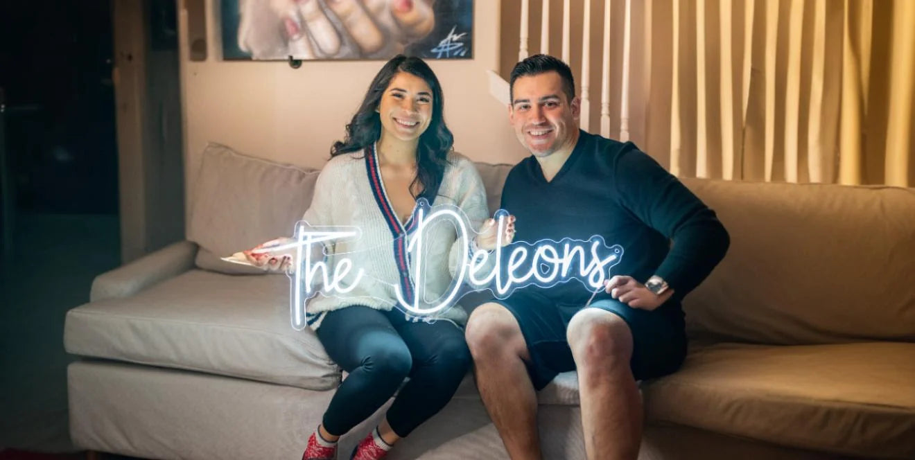 Love you neon sign glowing above couple sharing romantic moment 