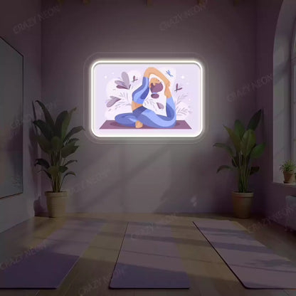 Rajakapotasana Yoga Neon Artwork lighting up in warm white color in a yoga room