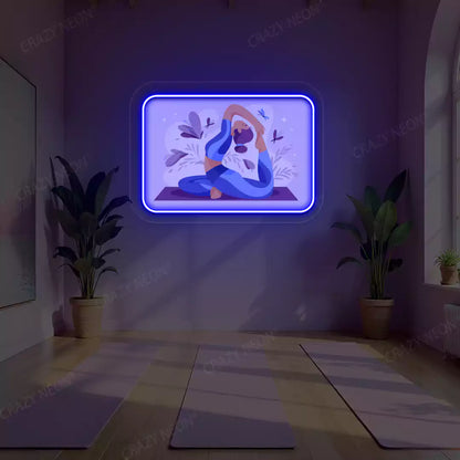 Rajakapotasana Yoga Neon Artwork lighting up in blue color in a yoga room
