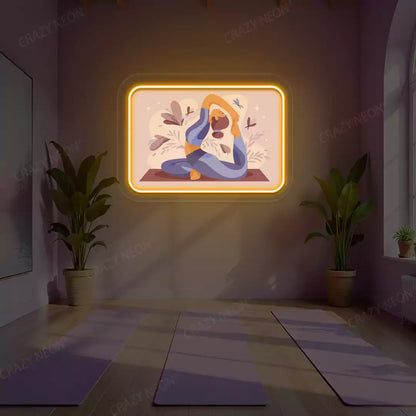 Rajakapotasana Yoga Neon Artwork lighting up in orange color in a yoga room