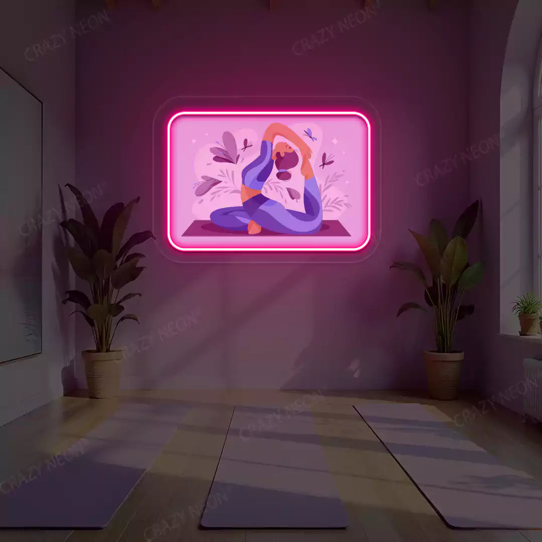 Rajakapotasana Yoga Neon Artwork lighting up in pink color in a yoga room