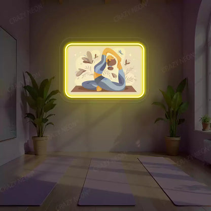 Rajakapotasana Yoga Neon Artwork lighting up in yellow color in a yoga room
