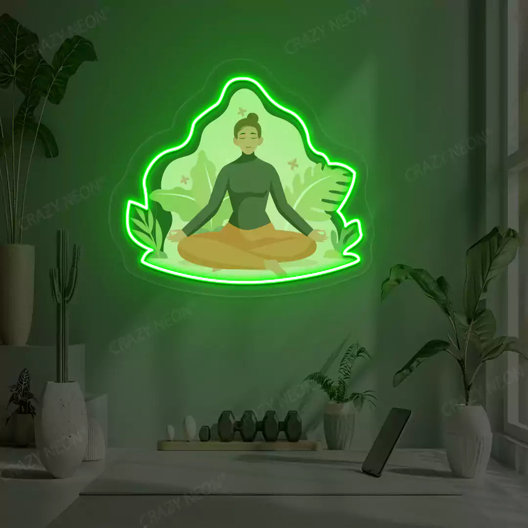 Sukhasana Leaf Yoga Neon Artwork lighting up in green color in a yoga room