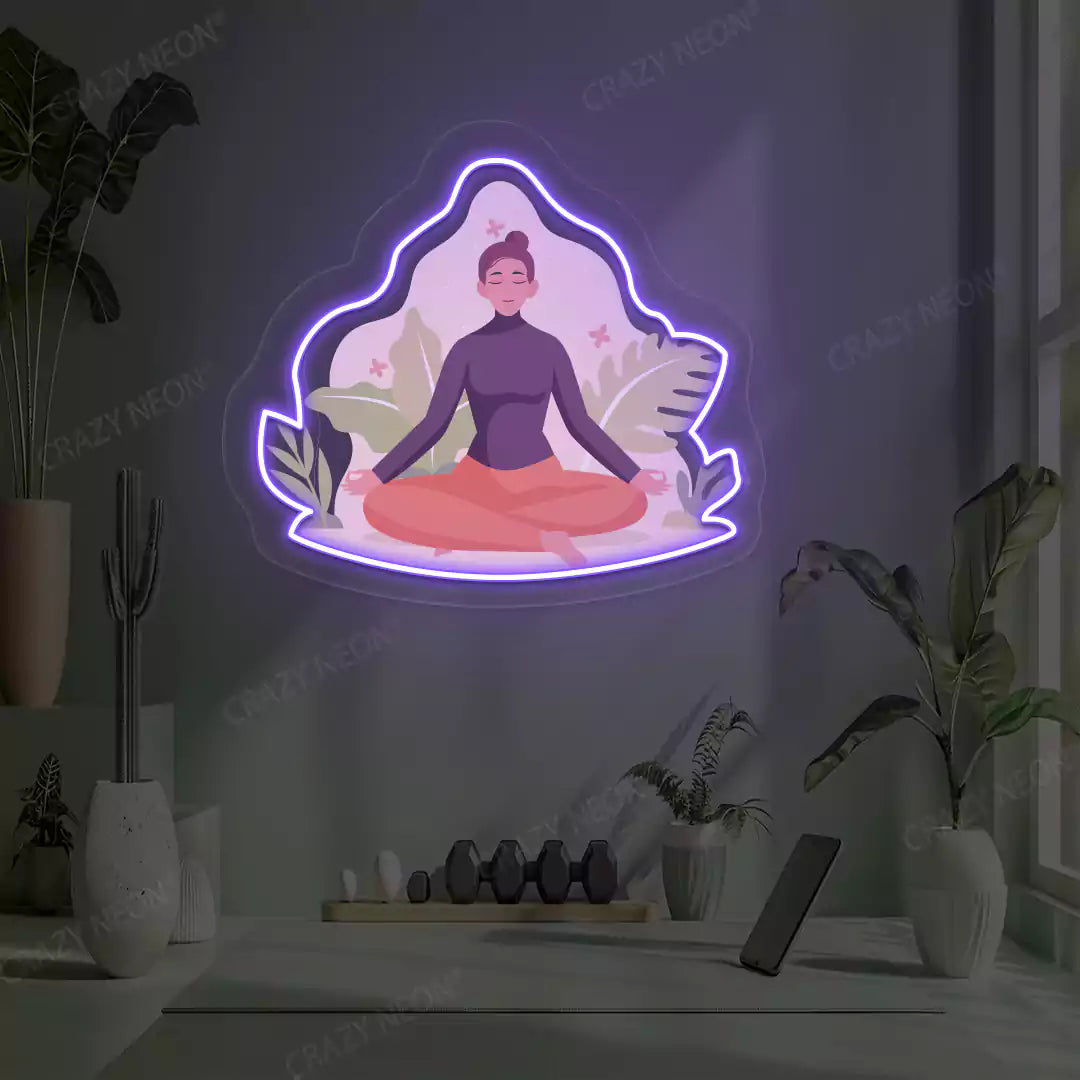 Sukhasana Leaf Yoga Neon Artwork lighting up in purple color in a yoga room