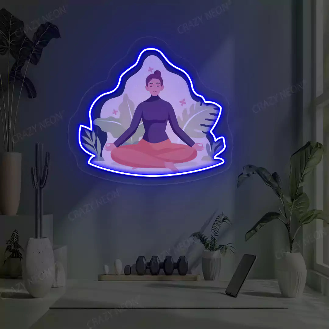 Sukhasana Leaf Yoga Neon Artwork lighting up in blue color in a yoga room