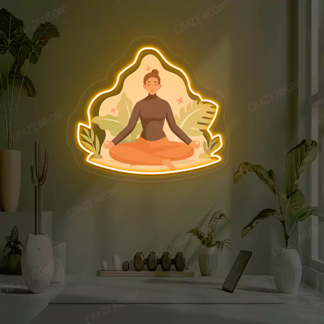Sukhasana Leaf Yoga Neon Artwork lighting up in orange color in a yoga room