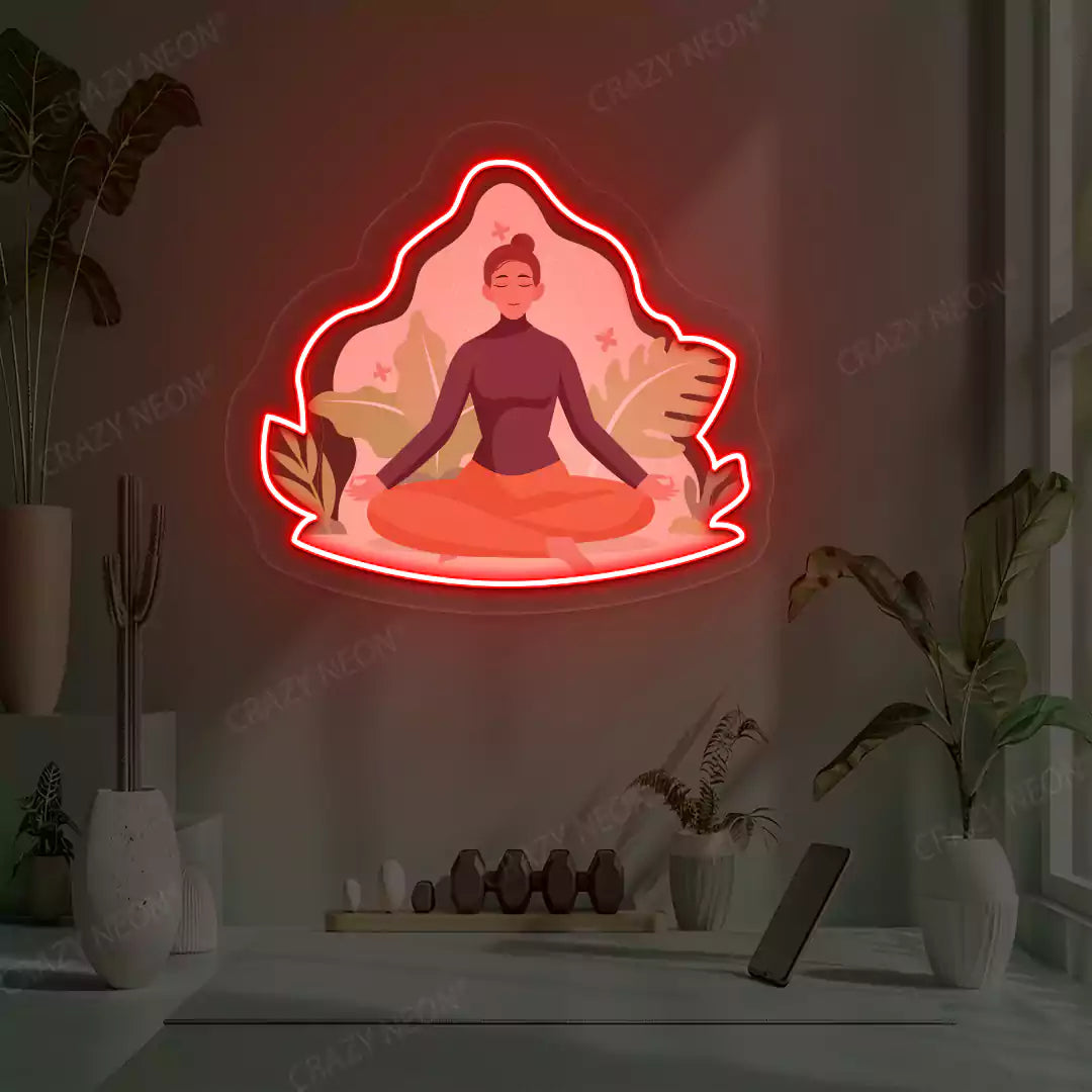 Sukhasana Leaf Yoga Neon Artwork lighting up in red color in a yoga room