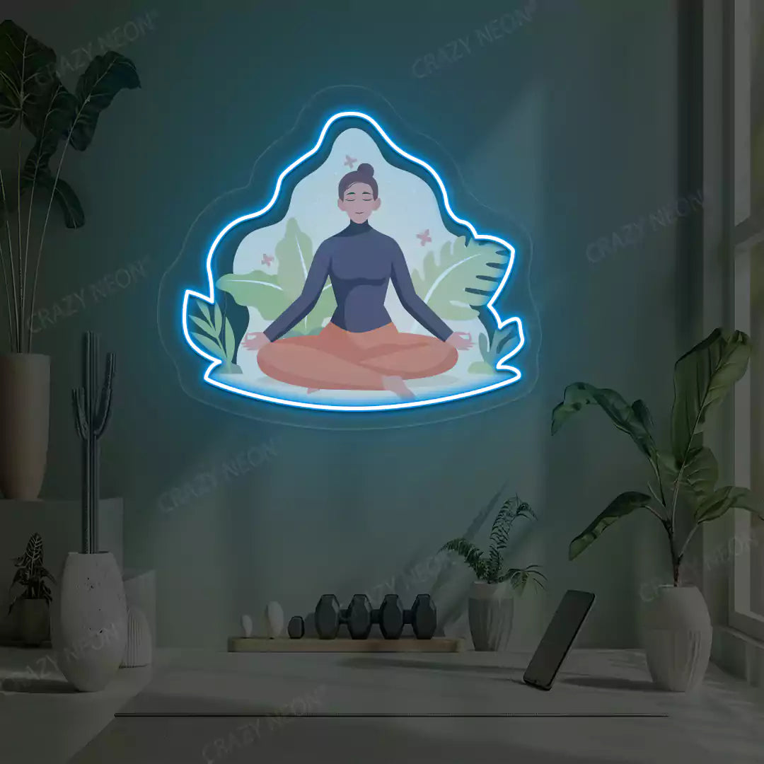 Sukhasana Leaf Yoga Neon Artwork lighting up in iceblue color in a yoga room