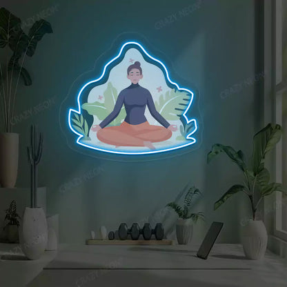 Sukhasana Leaf Yoga Neon Artwork lighting up in iceblue color in a yoga room