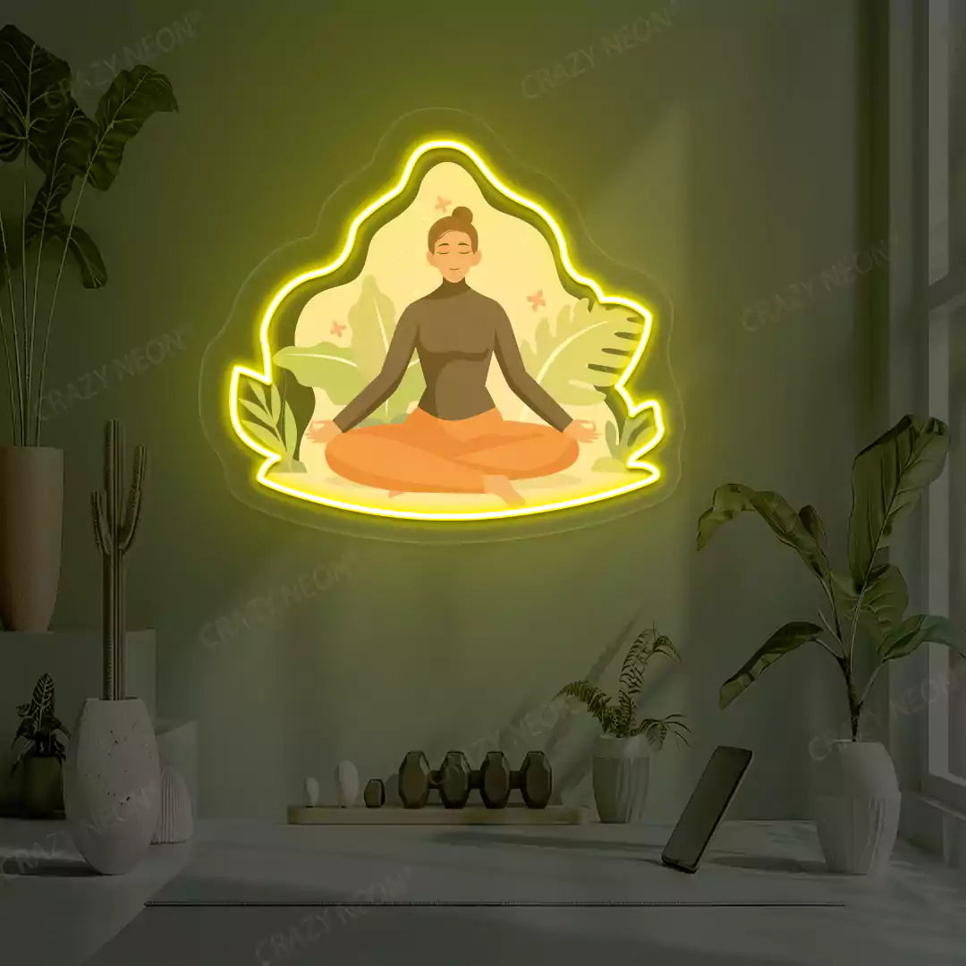 Sukhasana Leaf Yoga Neon Artwork lighting up in yellow color in a yoga room