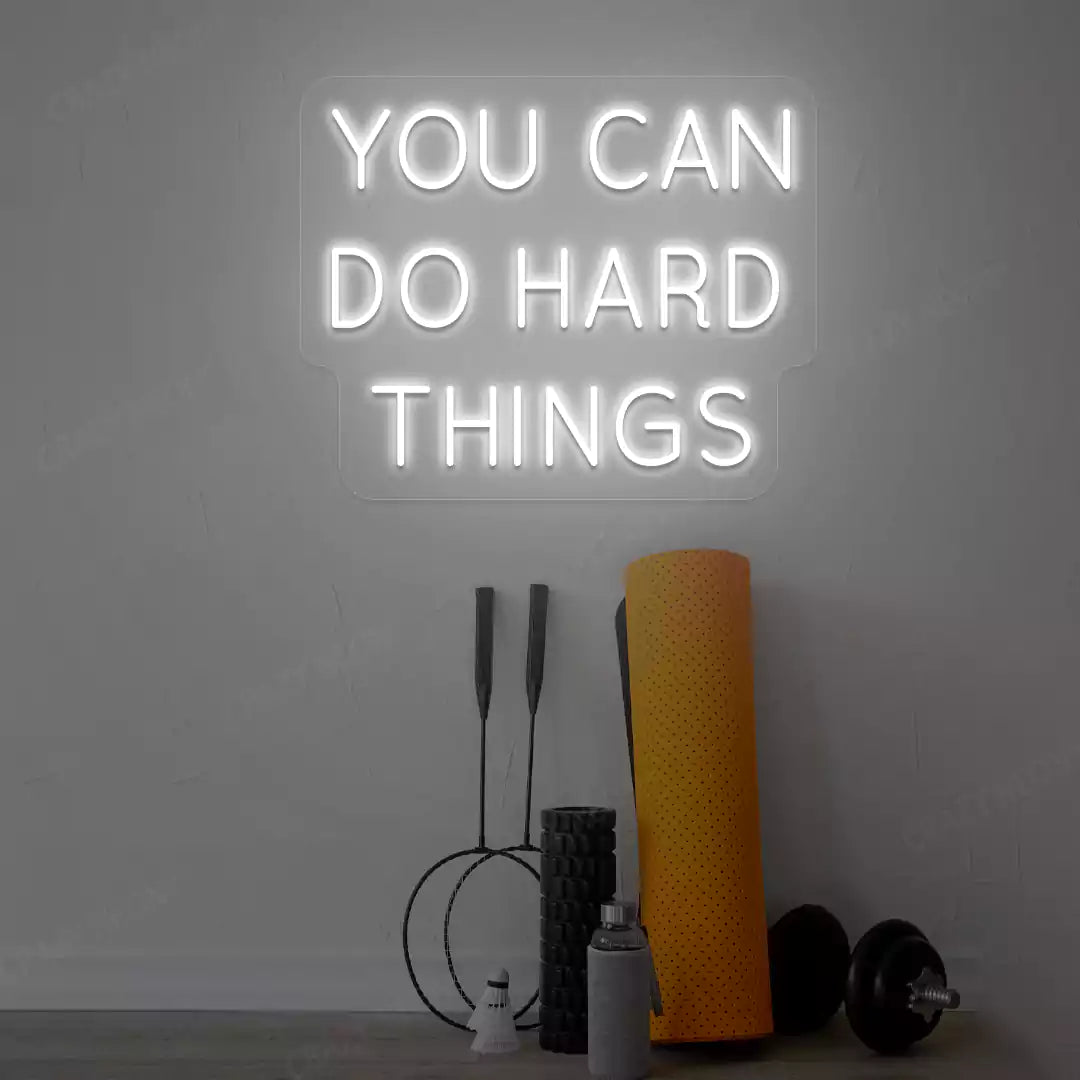 white you can do hard things neon sign mounted on a wall