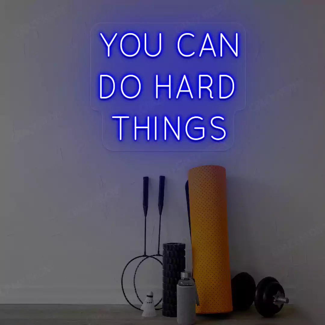 blue you can do hard things neon sign mounted on a wall