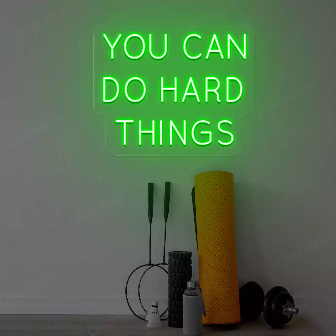 green you can do hard things neon sign mounted on a wall