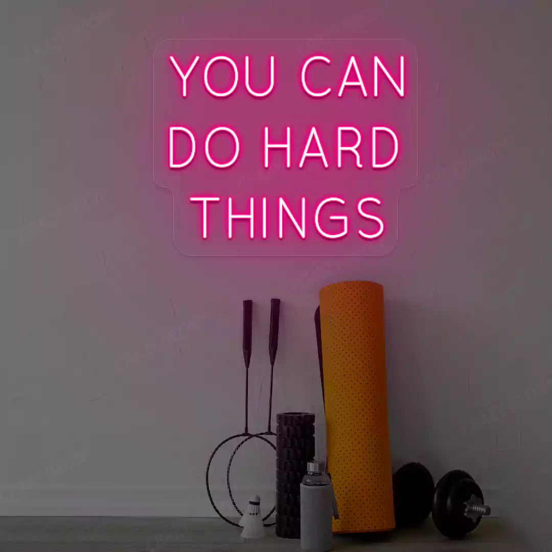 pink you can do hard things neon sign mounted on a wall